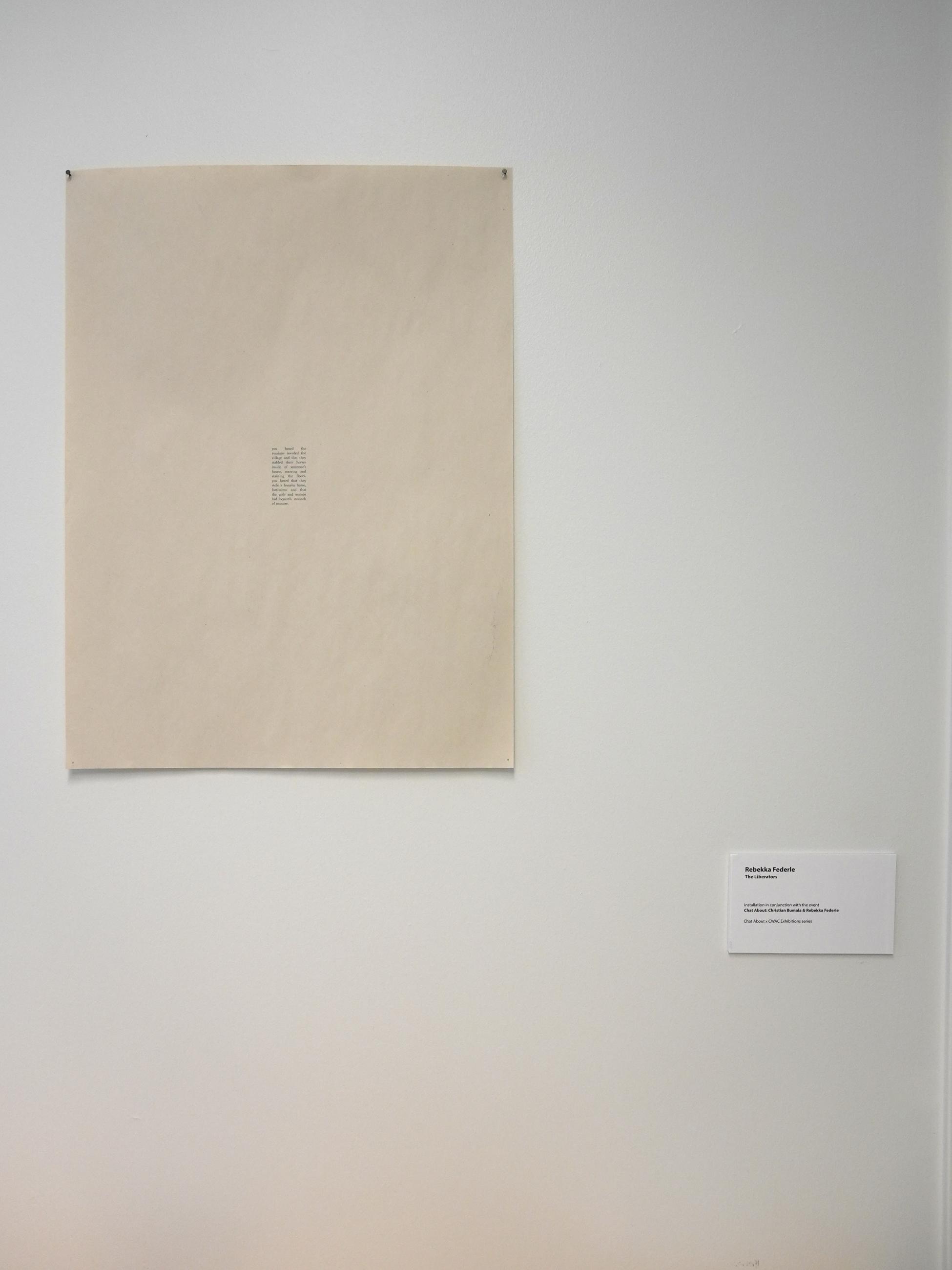 Small print on a large cream colored paper with wall label