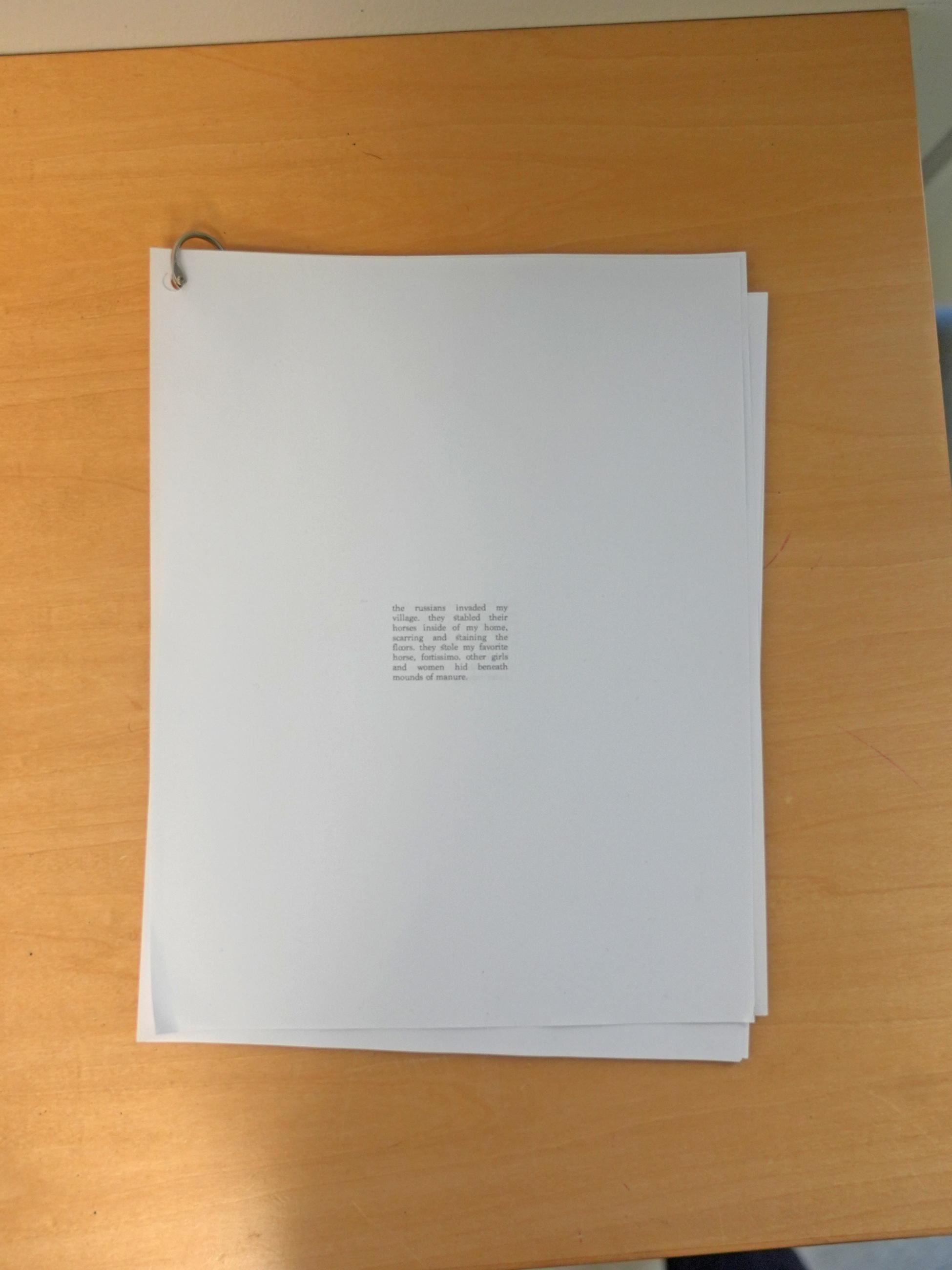 packet of papers with small printed text centered