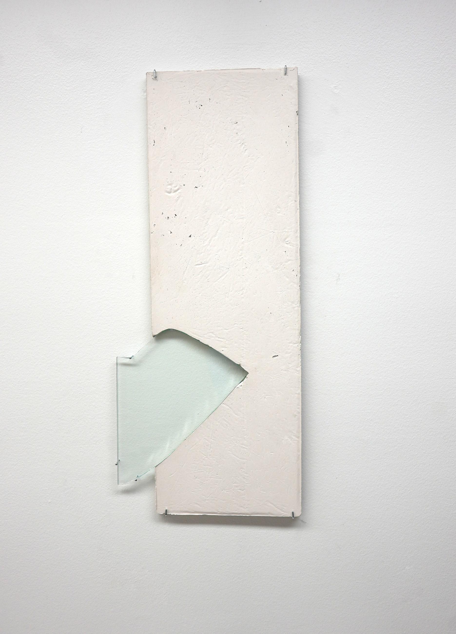 Rectangular wooden plank with glass insert hung on white wall