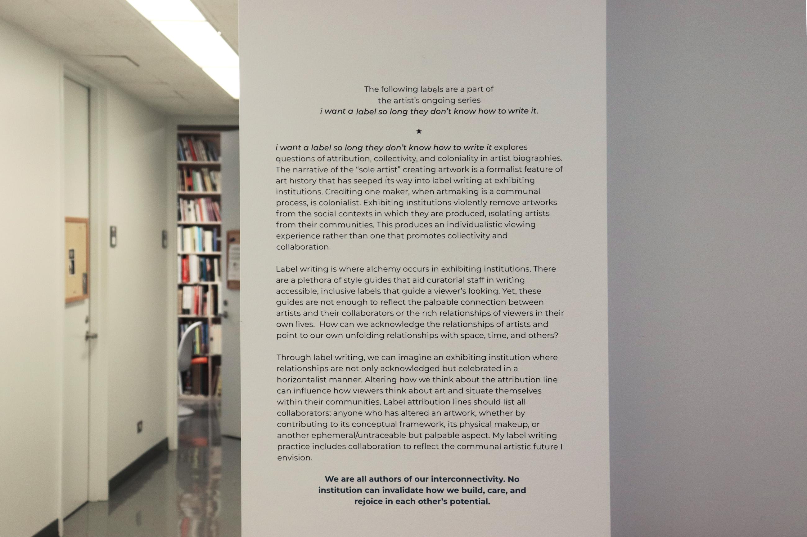 Vinyl wall label on critical fabulation on a white wall