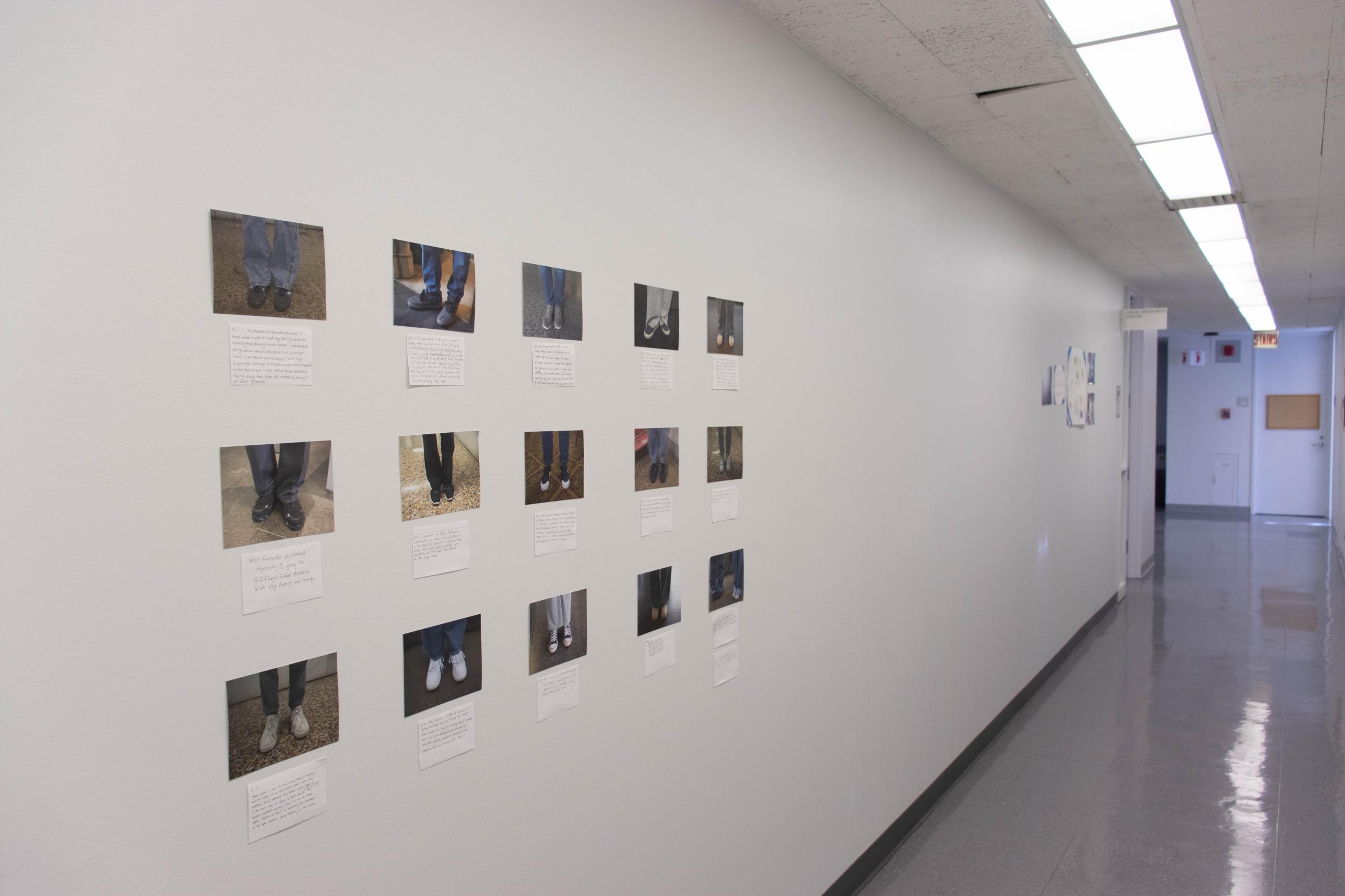small photographs of shoes on a white hallway wall in a grid formation