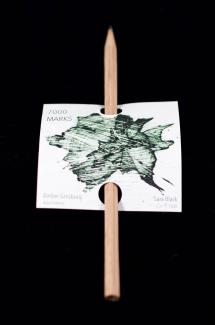 Small pencil fitted through a printed paper holder
