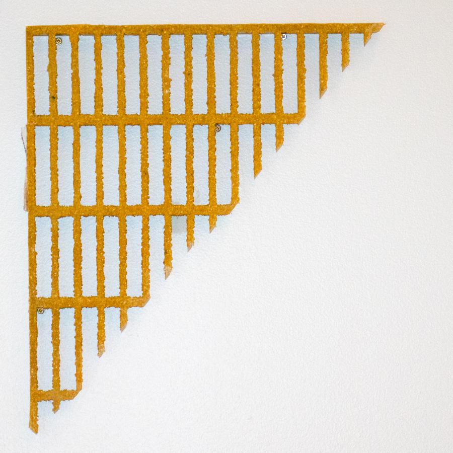 Triangle of yellow gridded fiberglass on white background